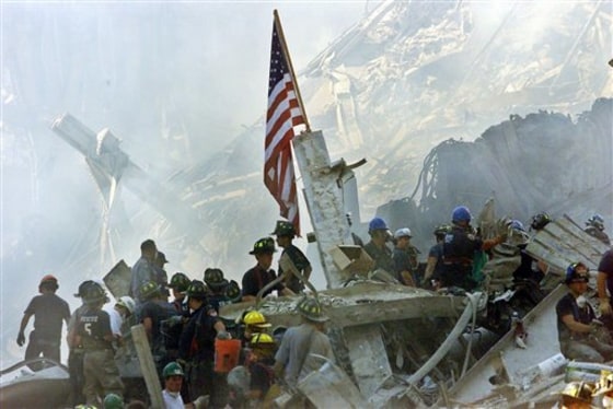 An American flag flies over the rubble of the World Trade Center in New York after the Sept. 11 attacks.